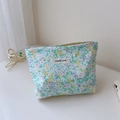 Detail of floral makeup bag with simple wish label and silver zipper on white surface - Yellow Green Small Floral