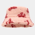 Close-up of the plush pink lamb wool texture with red patterns on the winter bucket hat - M (56-58cm) / Pink (Red Pattern)