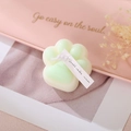 Cat paw shaped scented candle in off-white and green finish with artisan label - Green (Sage & Sea Salt)