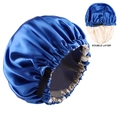 Close-up of double layer satin sleep cap in navy and beige with adjustable elastic strap - Sapphire Blue