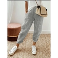 Detailed view of grey and white striped woven casual trousers on a model in a cozy room - XS / Bottoms / Light Gray