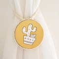 Detail of wooden curtain tieback featuring a hand-painted cactus motif and cotton rope - Yellow Cactus Style