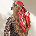Red retro paisley print 90x90cm satin headscarf shown tied on a model's head - S204 Red