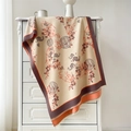 Detailed macro texture of a beige cashmere-style scarf with traditional ink bamboo prints - 190x65cm / Beige Orange