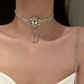 Baroque crystal pearl choker with lace band and rhinestone fringe worn by a model - Beaded Rhinestone Crystal Oval Multi-layer Style