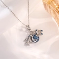 Close-up of travel charm necklace with silver airplane, globe, and suitcase pendants - Silver Airplane Earth Style B