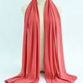 Deep coral red chiffon headscarf with sheer texture shown on a mannequin display - 44