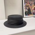 Detailed close-up of the pleated black satin ribbon and texture on a straw boater hat - Black/Same Color Ribbon