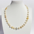Baroque heart bead necklace with creamy iridescent pearls and gold spacers on a bust - Light Yellow