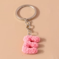 Pink resin letter E keychain with detailed rose petal textures and silver metal ring - Letter E