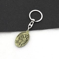 Vintage bronzen St. Christopher sleutelhanger met een ovale religieuze hanger - Retro Brons