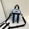 Light blue nylon crossbody bag for women with dual buckles and adjustable black strap - Blue