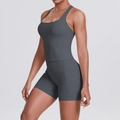 Detail of high-waist yoga shorts with functional side pockets in dark charcoal grey - S / Top And Bottom / Graphite Grey