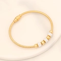 Detail of gold snake chain bracelet featuring alternating crystal pavé and polished beads - Round Beads (6#)