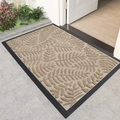 Rectangular beige entryway mat with leaf patterns and black border in doorway - Wind Fern-Khaki (Rubber Bottom)
