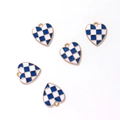 Detail of five heart-shaped pendants with blue and white plaid enamel and gold edges - Gold Tone Dark Blue White Checkerboard Heart