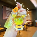 Detail of yellow Mickey liquid glitter keychain with bubble strap and cute figure charm - Yellow Sitting Bear with Gradient Rope