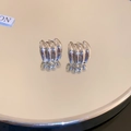 Detailed view of silver textured C-hoop earrings featuring vertical relief ridges on mirror - Vertical Relief Ridged Texture C-shaped Earrings (17#) / Silver