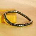 Deep gray metallic hematite bracelet with arrow-shaped links and mirror finish - Gear Shape
