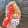 Cute snowman Christmas keychain with red silicone wrist strap and golden key ring. - Snowman