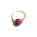 Handmade gold wire-wrapped ring featuring a magenta faux gemstone bead on white background - One Size / Red Tiger Eye