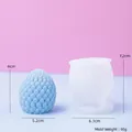 Blue 3D pinecone candle with its translucent silicone mold and 90g weight marker - Dragon Egg Scales / Round