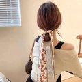 Elegant cream white long hair ribbon with orange floral pattern tied in a ponytail style - Orange Flower