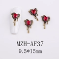 Macro shot of 9.5x15mm red heart gem nail charm with melting gold alloy metal base - AF37-Gold Red Heart Molten Charm