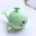 Mint green silicone whale tea infuser with cute cartoon face and spray-shaped handle - Green Bath Whale