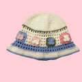 Detail view of handmade crochet bucket hat with colorful floral knit squares in white - One Size / Eight Butterflies Hat