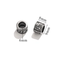 Detailed macro view showing 8mm stainless steel beads with retro pattern and dimensions - 9x8mm/Hole 6mm / Greek Key Cylinder-Style 5
