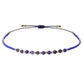 Gevlochten armband met 2mm donkerblauwe gefacetteerde steentjes en gouden kralen - Marineblauw