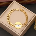 Bracciale occhio greco dorato con maglia cubana e cristalli su scatola - Bracciale