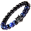 Macro detail of men's beaded bracelet featuring a wolf head and blue tiger eye stones - Blue Tiger Eye Stone