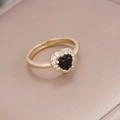 Macro detail of 18K gold ring with black heart zircon and sparkling micro-inlaid diamonds - Black / Adjustable Open
