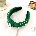 Detailed view of green fabric headband with elegant faux pearls and sparkling rhinestones - Green