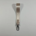 Detail of woven beige wristlet keychain with silver hook and matching leather connector - Khaki