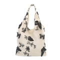 Chic cream canvas tote bag featuring black floral butterfly lace embroidery for women - Off White
