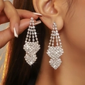 Elegant silver heart earrings with sparkling rhinestone tassels worn by a model - Silver Long Tassel Geometric Style (DTE1616214S-W)