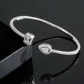 Close-up of adjustable silver cuff bracelet with pear and rectangular cut crystals - Silver