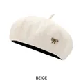 Beige wool blend beret hat with a gold metal bow charm and knit texture - M (54-58cm) / Beige