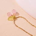 Detailed view of sweet cherry necklace with pink beads and green leaves on gold chain - Single Necklace / Pink