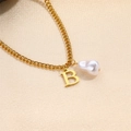 Elegant gold chain necklace featuring a baroque pearl and capital letter B pendant - Letter B Necklace
