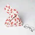 Detail of linen knot bag with fresh watermelon print and glasses for size reference - Watermelon Red