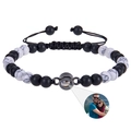 Macro detail of customized photo projection bracelet with zebra stone and matte black beads - White Turquoise + Frosted Stone Bracelet