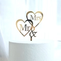 Detail of gold mirror acrylic Mr & Mrs double heart wedding cake topper on white cake - Double Intertwined Hearts MR&MRS