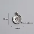 Detailed view of silver stainless steel round pendant with flower motif measuring 17x16mm - Central Flower Pattern Charm (P00071S)