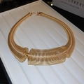 Detail of chunky gold spring coil necklace with bold industrial metal choker design - Spring Necklace / Gold