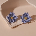 Detail of purple flower earrings with gold pistils displayed in a minimalist plaster bowl - Blue and Purple