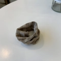 Detail of checkered brown fabric scrunchie with ribbed texture and pleated design - Light Brown Plaid